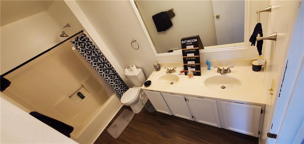 1426 Homestead Road Verona, PA 15147 - Photo 15 of 25 a bathroom with a sink and a mirror