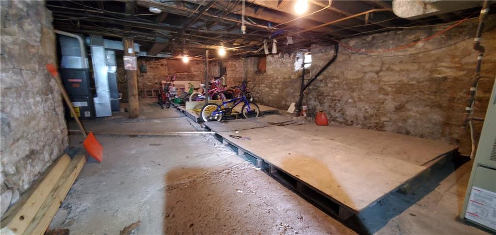 1426 Homestead Road Verona, PA 15147 - Photo 21 of 25 a view of a garage with a bike and car