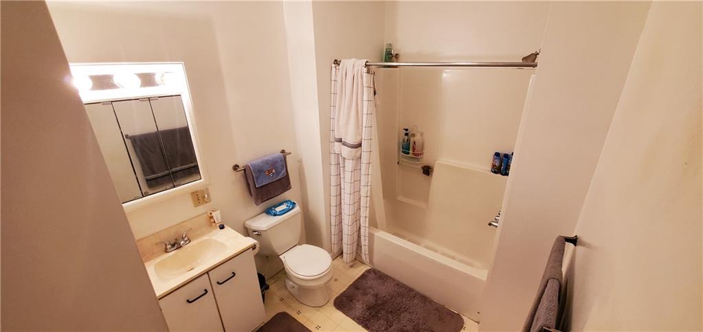 1426 Homestead Road Verona, PA 15147 - Photo 4 of 25 a white toilet sitting next to a bathroom sink