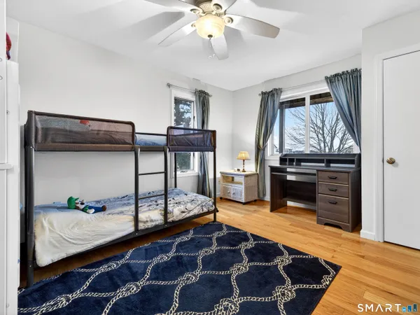 a bedroom with furniture and a chandelier