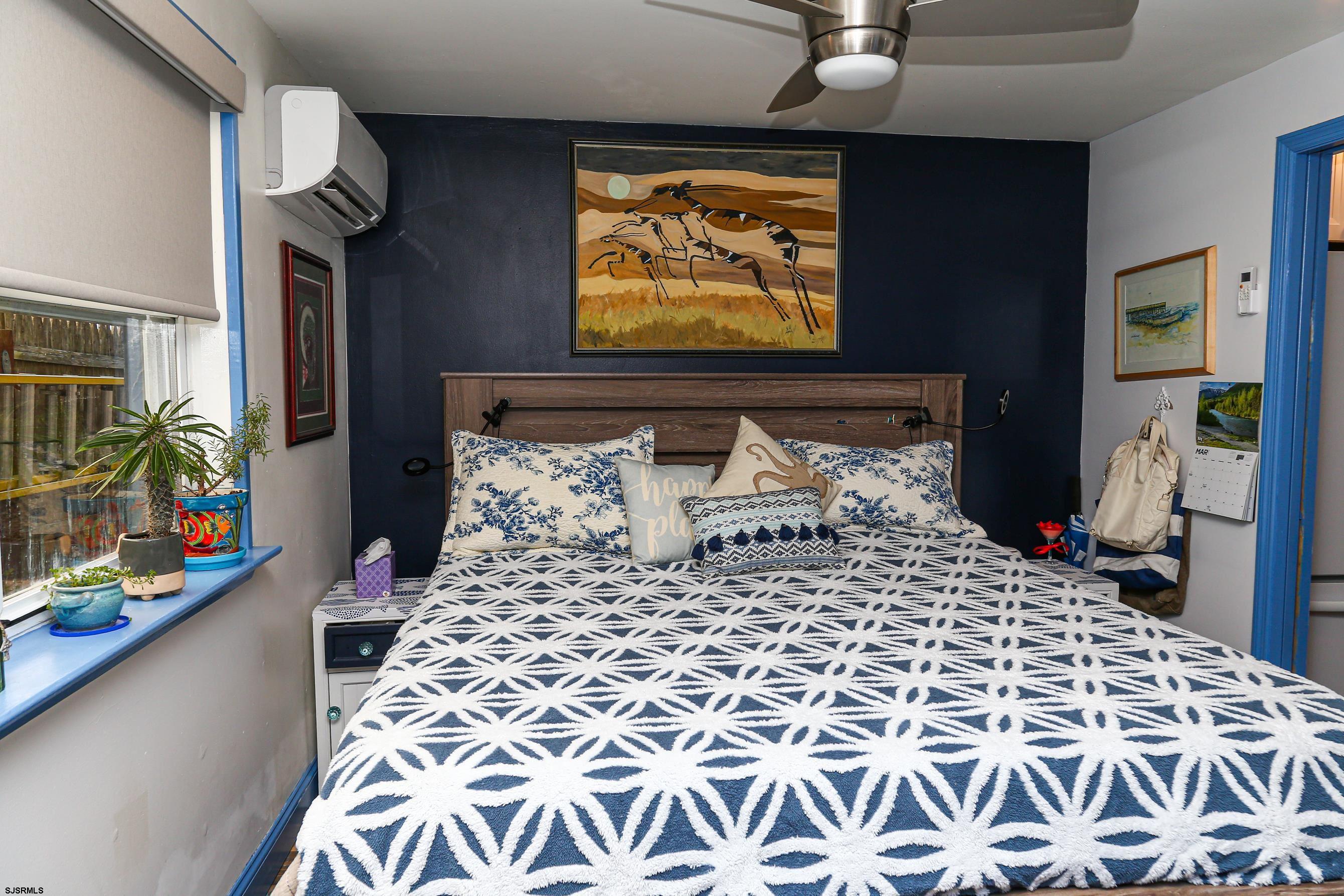 401 37th Street South, Unit 5 Brigantine, NJ 08203 - Photo 22 of 48 a bedroom with a bed and a window
