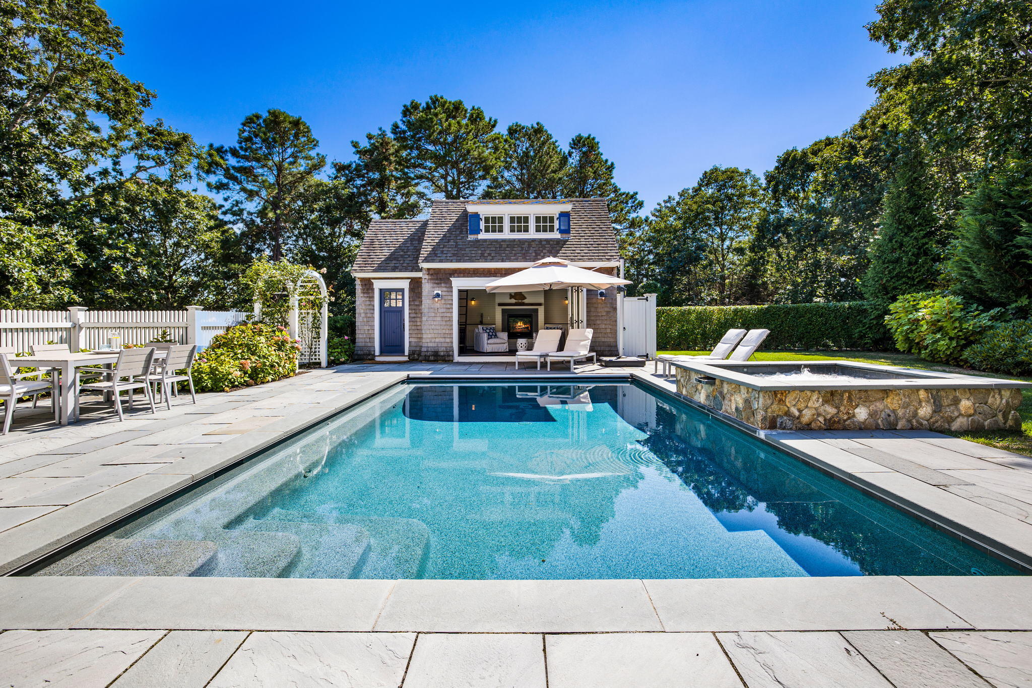 141 Point Hill Road West Barnstable, MA 02668 - Photo 2 of 26 swimming pool view with a seating space and a garden view