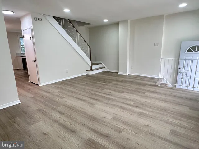 a view of a livingroom with wooden floor