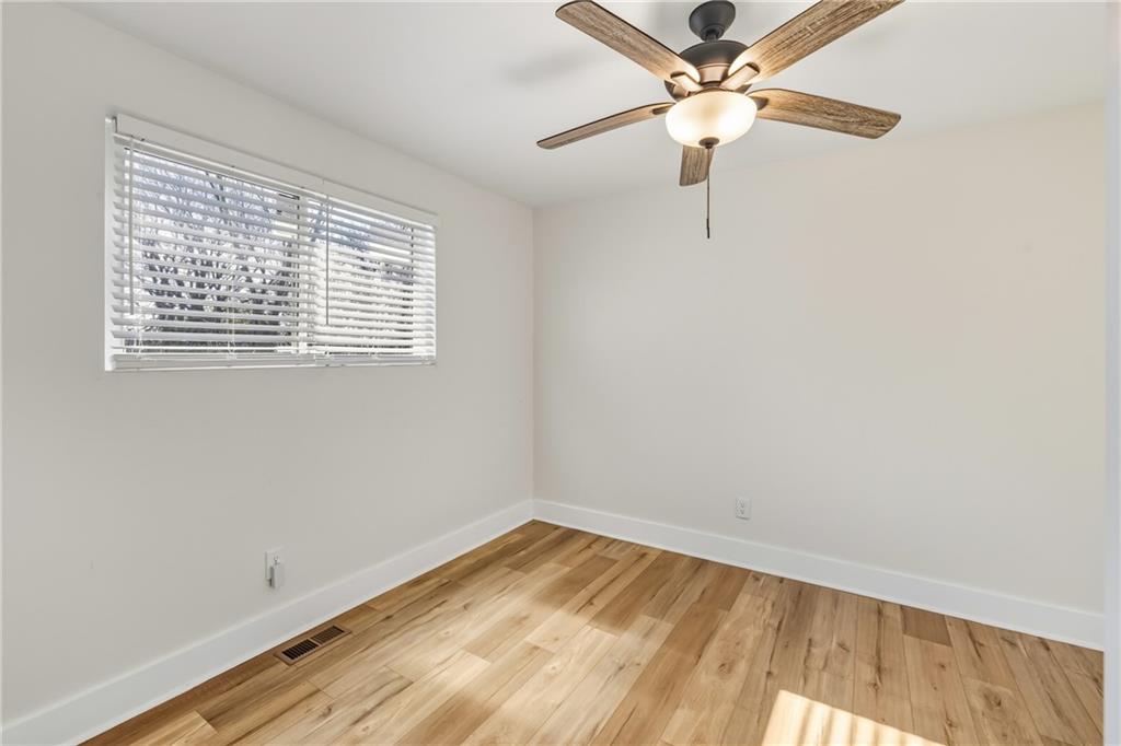 3822 Stephanie Drive Southwest Atlanta, GA 30331 - Photo 12 of 28 a view of a room with a window and a ceiling fan