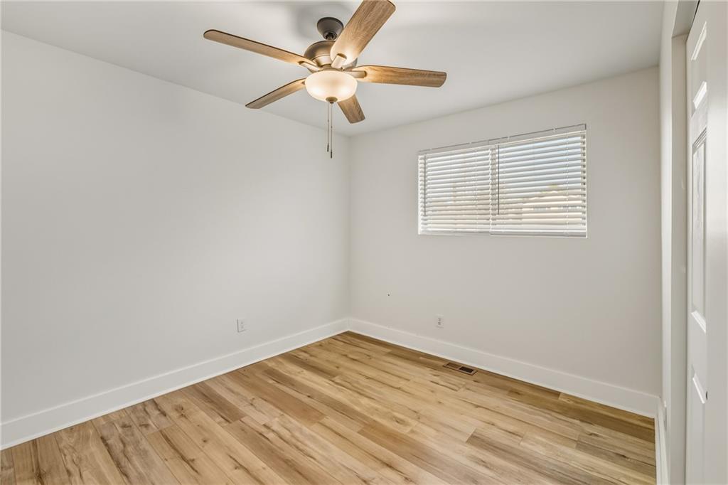 3822 Stephanie Drive Southwest Atlanta, GA 30331 - Photo 13 of 28 an empty room with a window and a ceiling fan