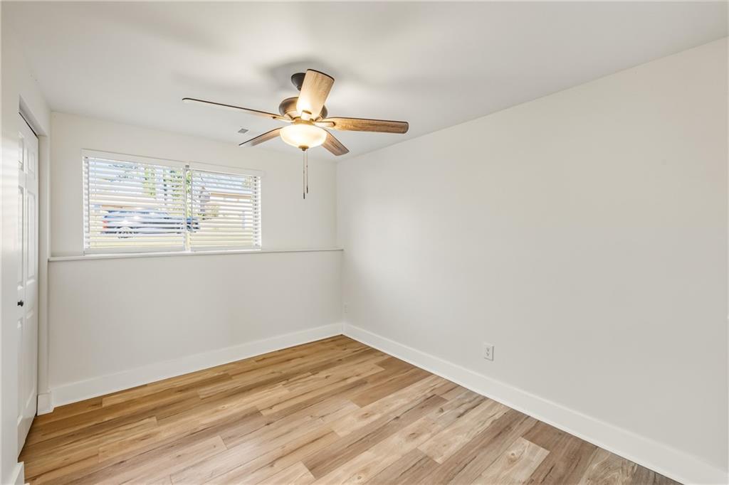 3822 Stephanie Drive Southwest Atlanta, GA 30331 - Photo 18 of 28 wooden floor in an empty room with a window