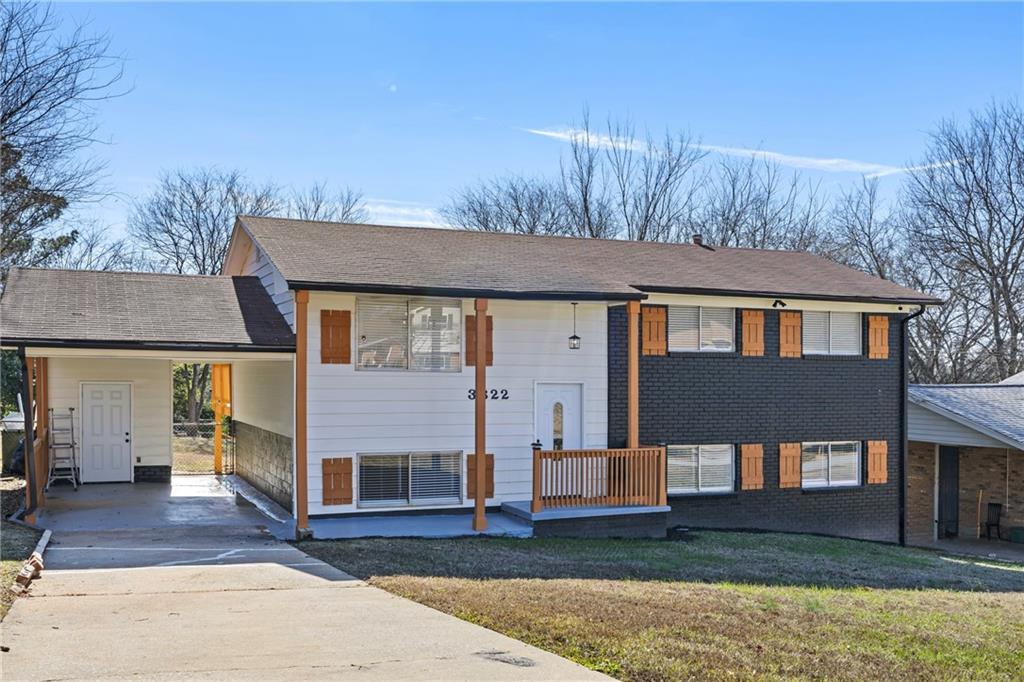 3822 Stephanie Drive Southwest Atlanta, GA 30331 - Photo 2 of 28 a front view of a house with a yard