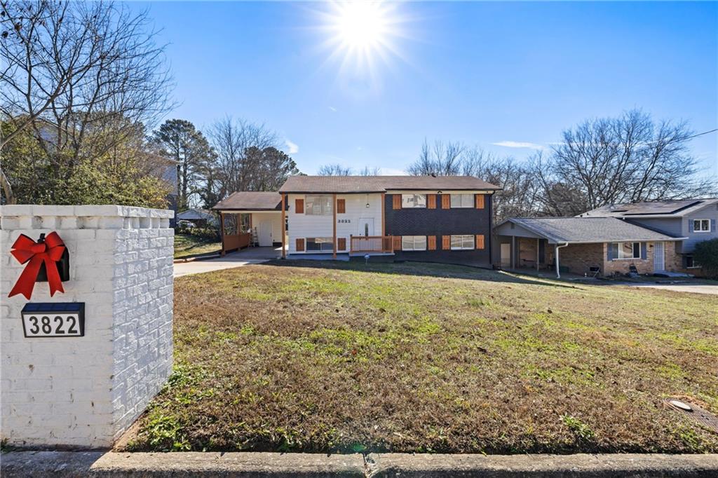 3822 Stephanie Drive Southwest Atlanta, GA 30331 - Photo 3 of 28 front view of a house with a yard