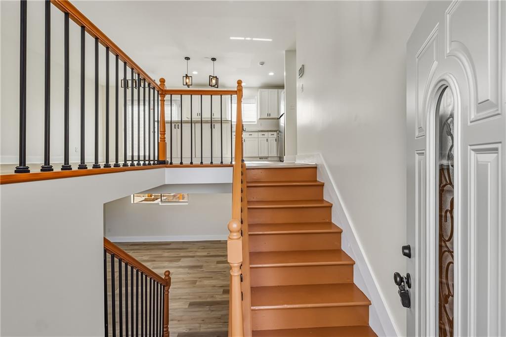 3822 Stephanie Drive Southwest Atlanta, GA 30331 - Photo 4 of 28 a view of staircase with white walls and a window
