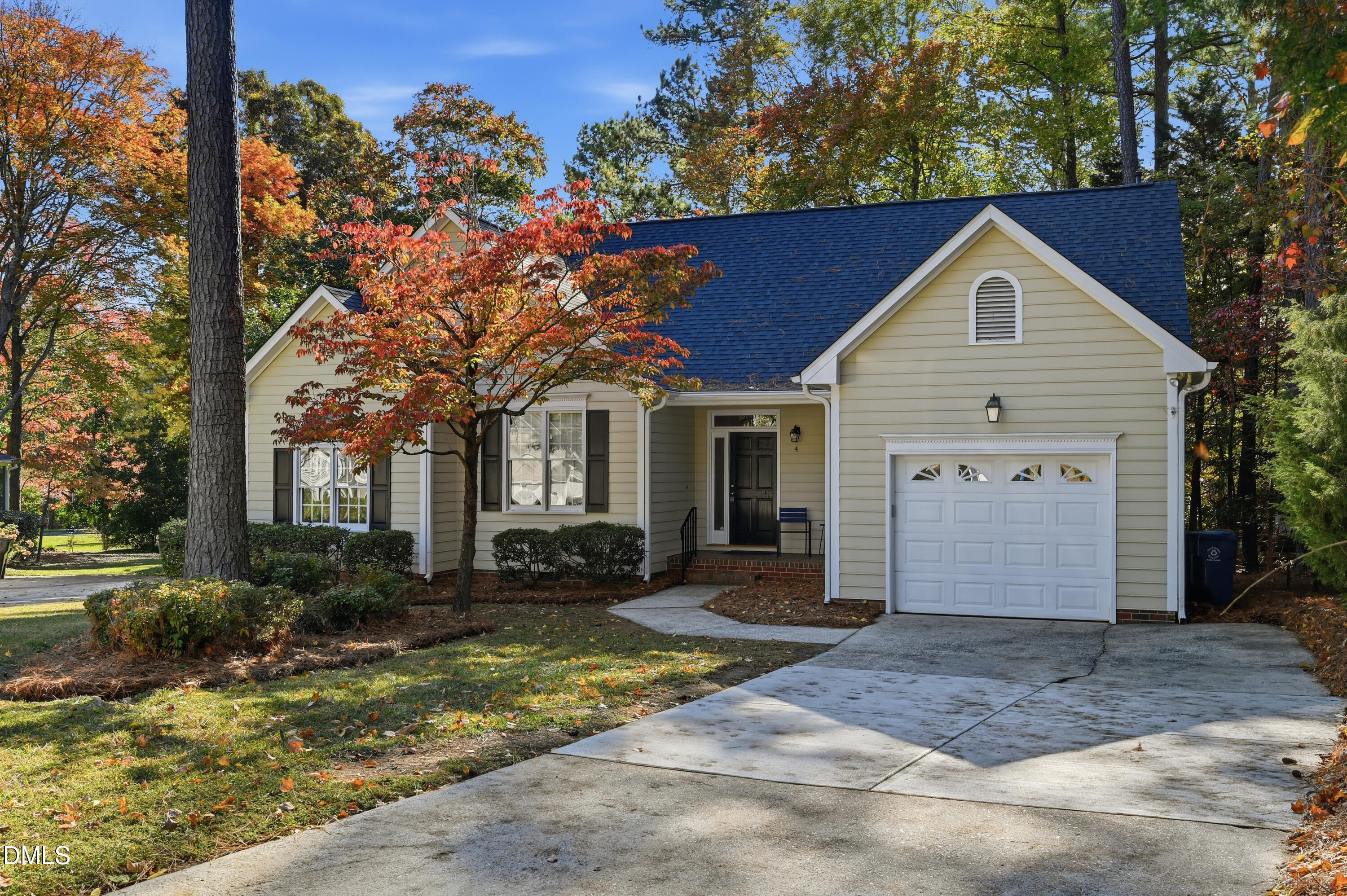 4 Wembley Court Durham, NC 27705 - Photo 1 of 41 a front view of a house with a yard and garage