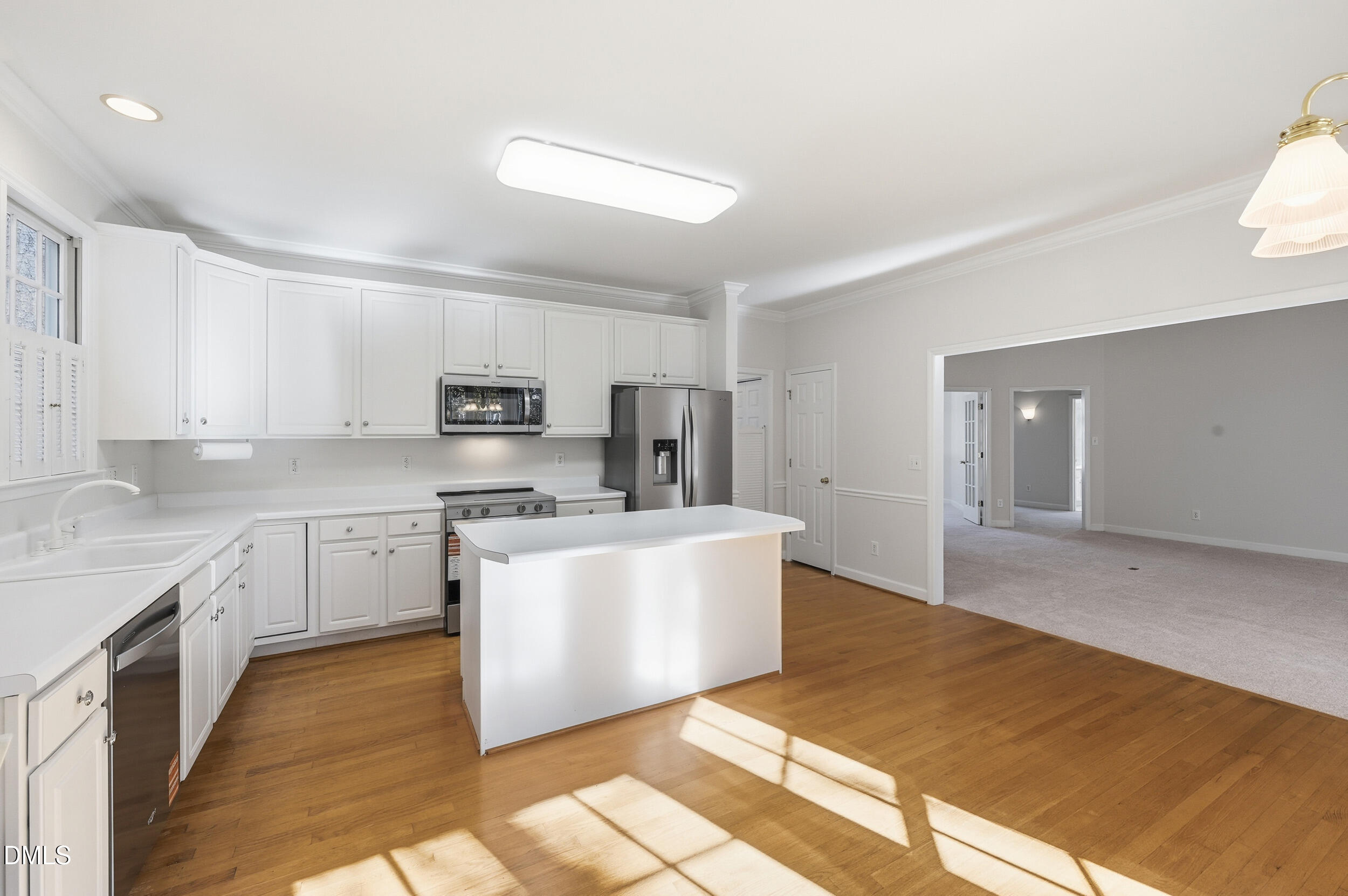 4 Wembley Court Durham, NC 27705 - Photo 12 of 41 a large kitchen with stainless steel appliances granite countertop a stove and a sink