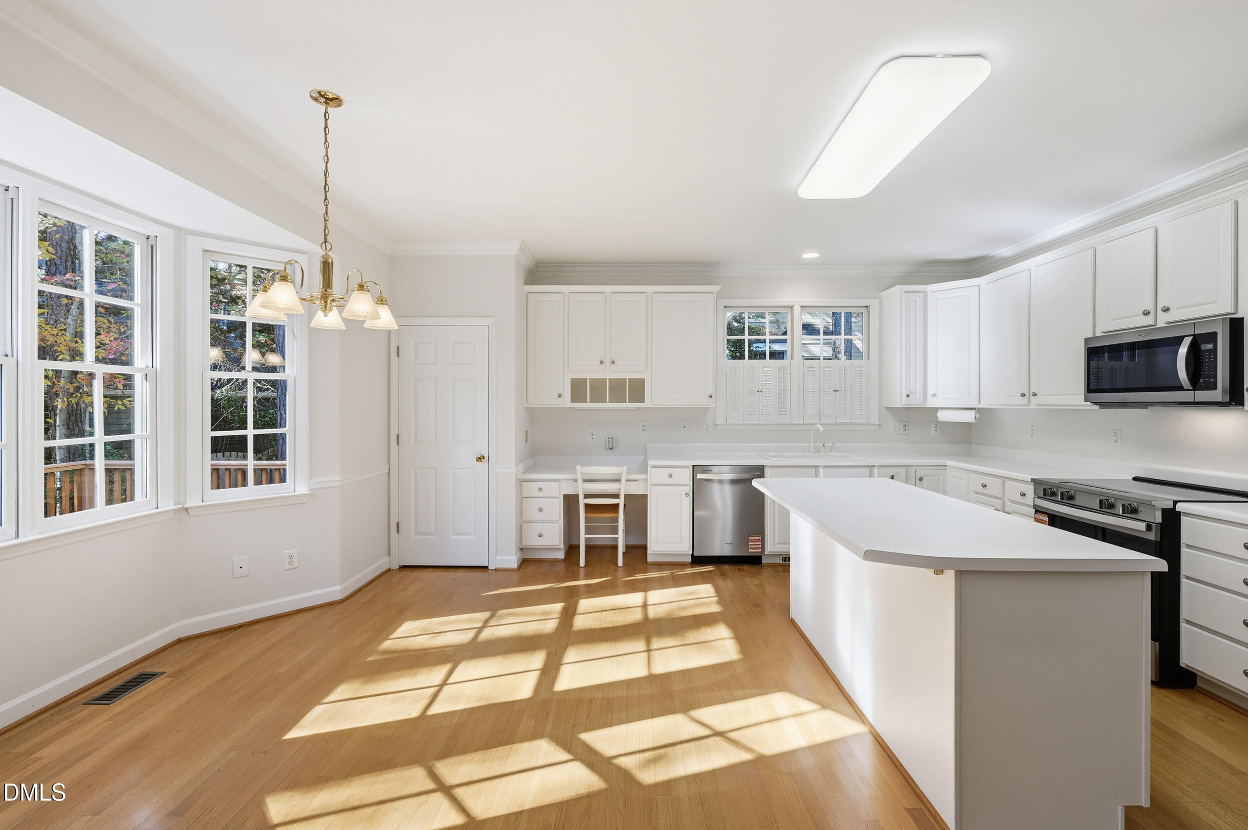 4 Wembley Court Durham, NC 27705 - Photo 14 of 41 a kitchen with stainless steel appliances granite countertop a sink stove and refrigerator