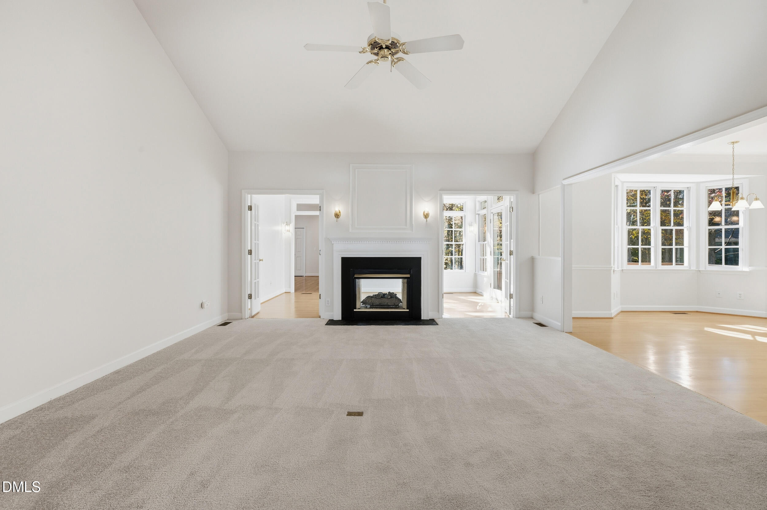 4 Wembley Court Durham, NC 27705 - Photo 19 of 41 an empty room with windows and fireplace