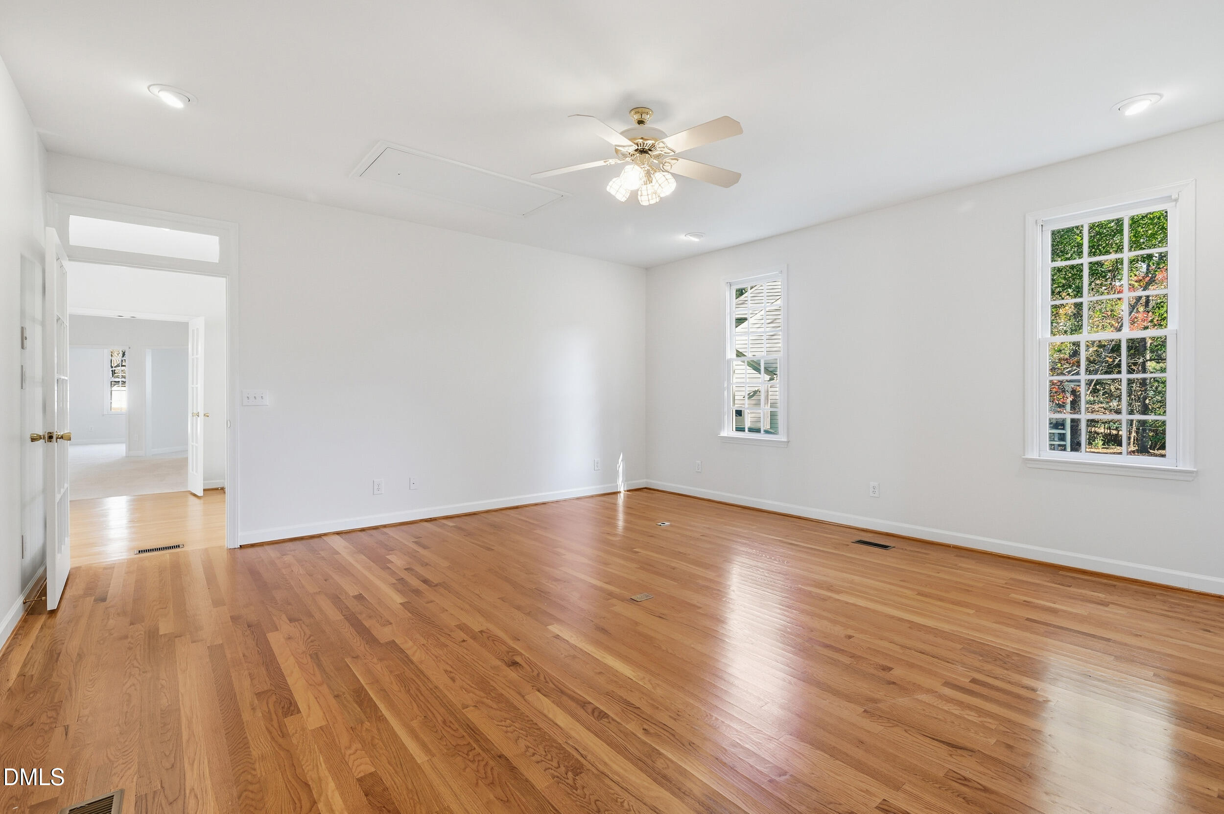 4 Wembley Court Durham, NC 27705 - Photo 25 of 41 a view of an empty room with wooden floor and a window