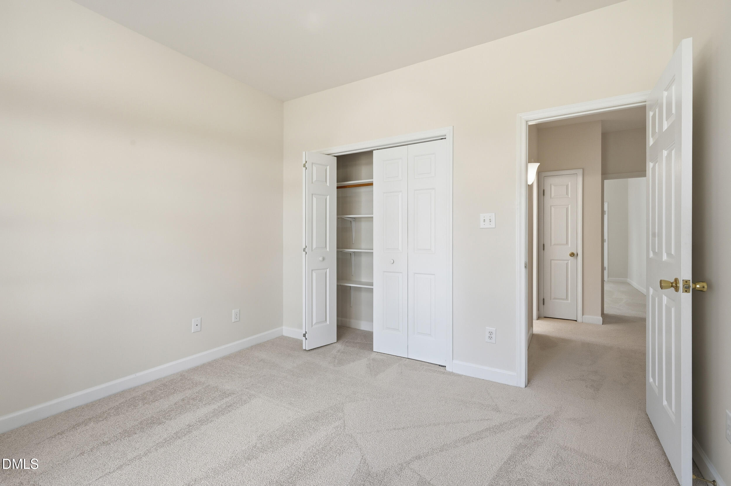 4 Wembley Court Durham, NC 27705 - Photo 32 of 41 an empty room with closet and a bathroom