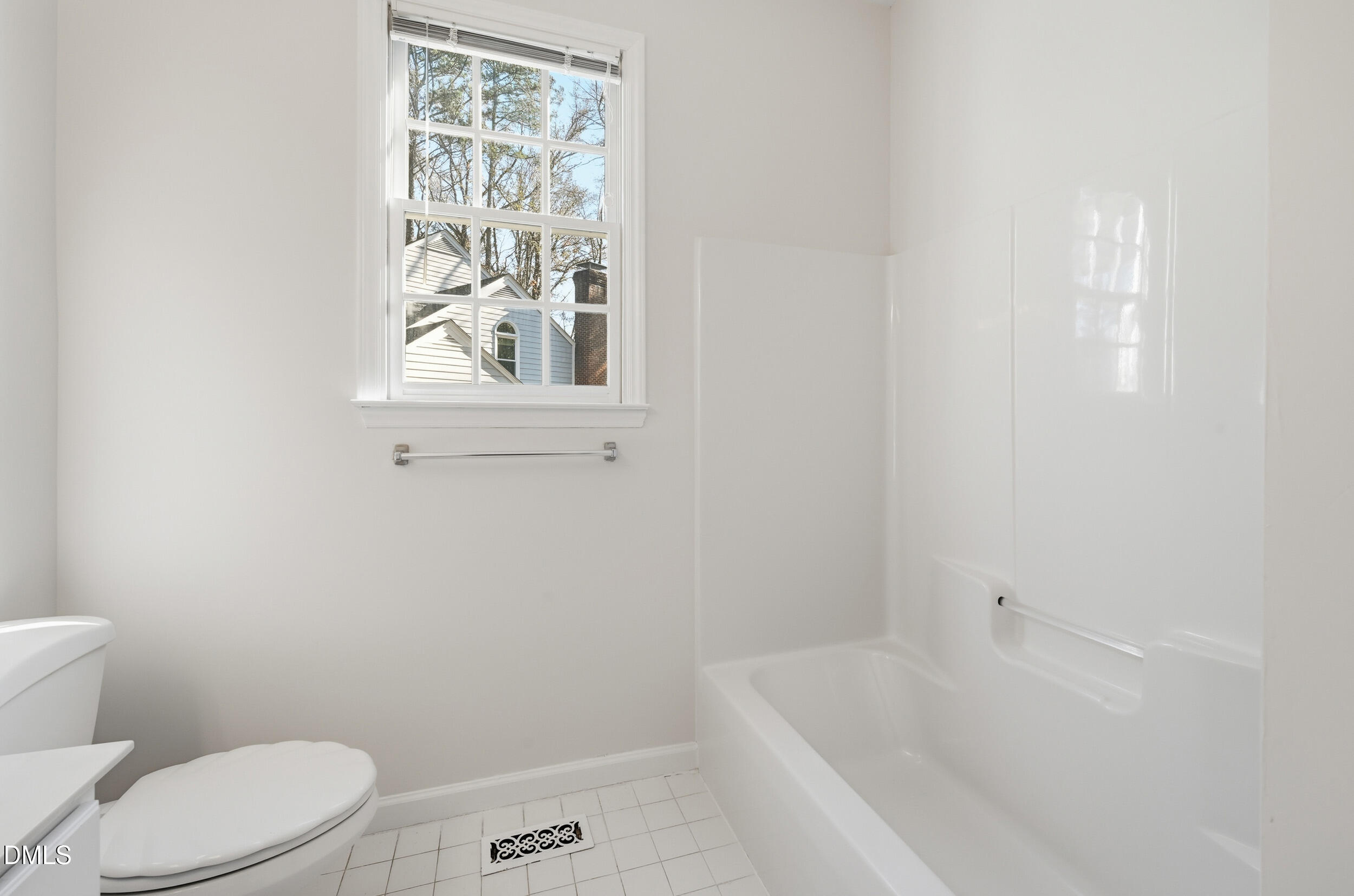 4 Wembley Court Durham, NC 27705 - Photo 34 of 41 a bathroom with a bathtub and window