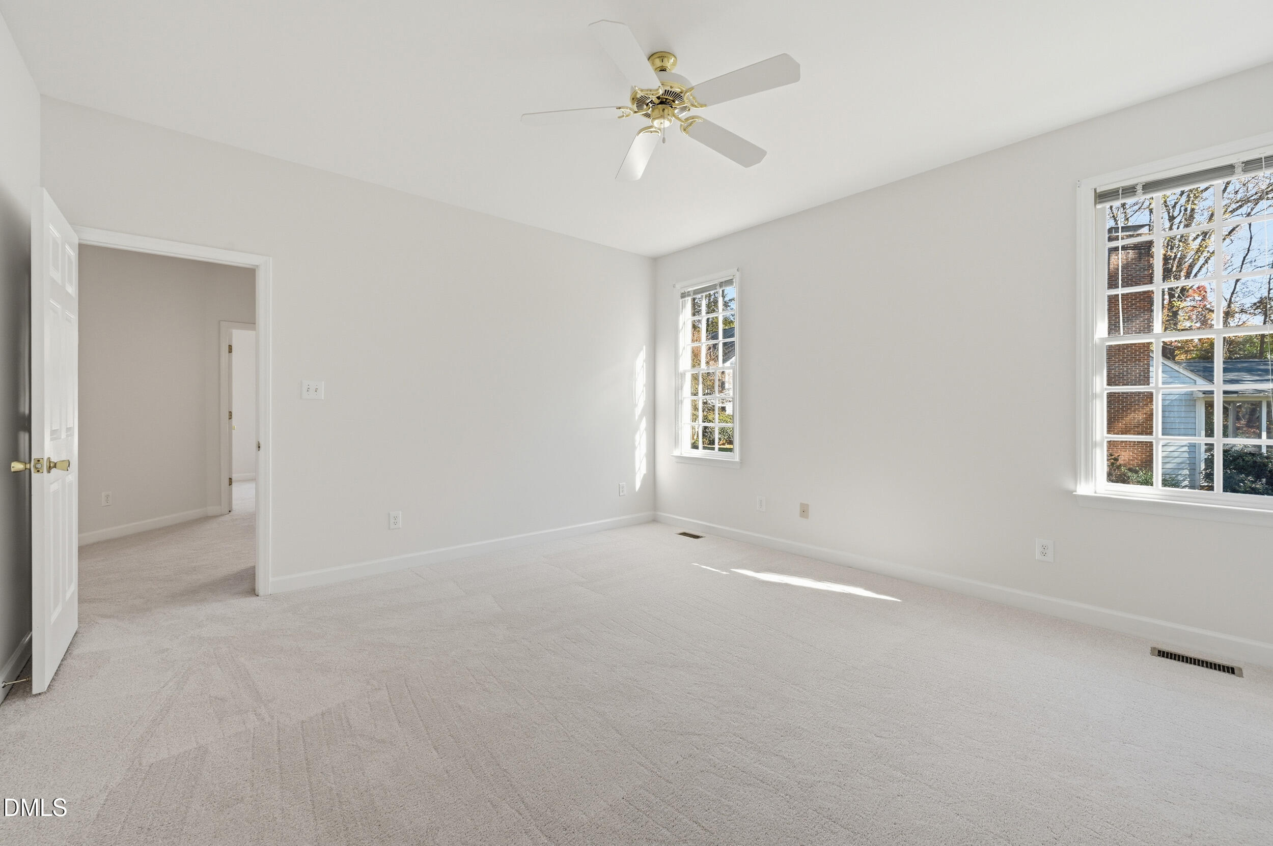4 Wembley Court Durham, NC 27705 - Photo 36 of 41 an empty room with windows and ceiling fan