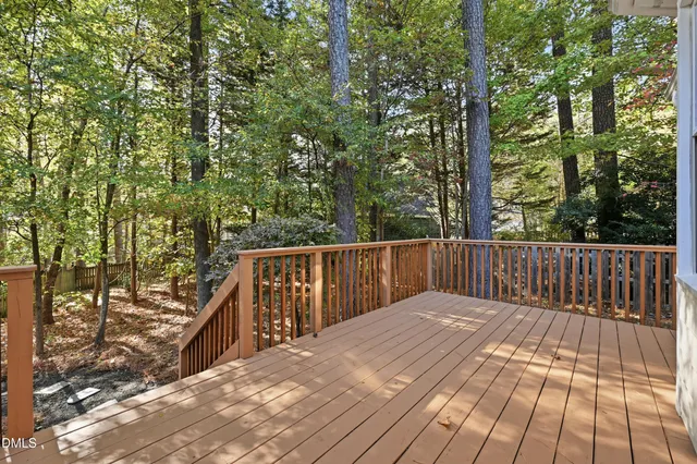a balcony with trees in front of it