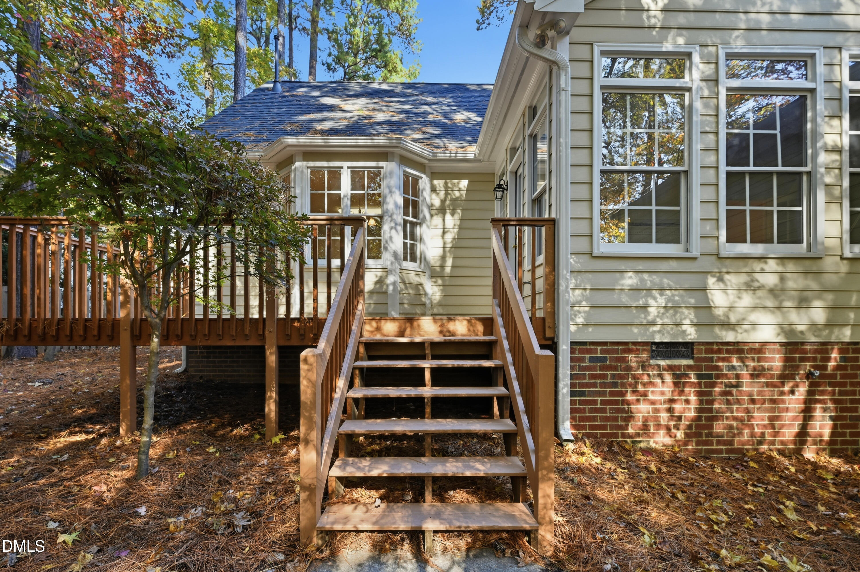 4 Wembley Court Durham, NC 27705 - Photo 10 of 41 a view of a patio with table and chairs with wooden floor and fence