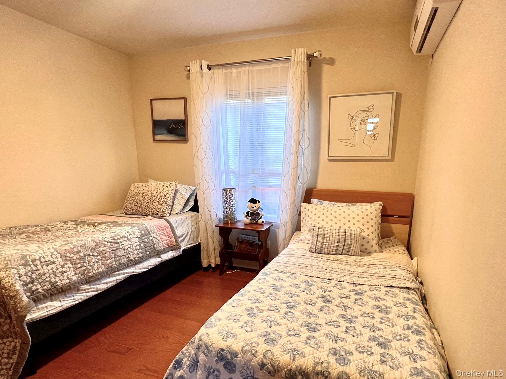 147-22 Ash Avenue Queens, NY 11355 - Photo 12 of 22 a bedroom with bed and window