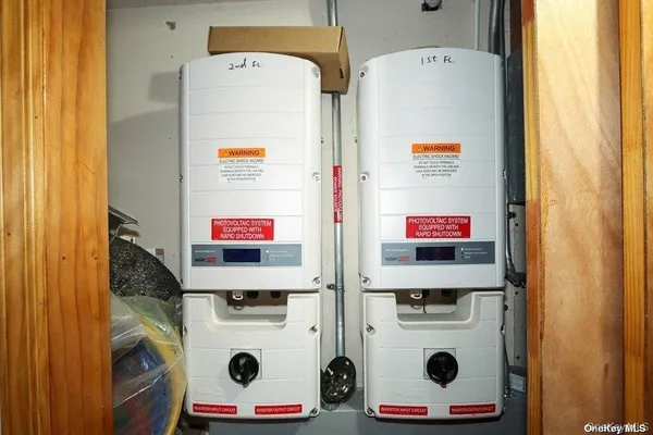 a utility room with a refrigerator and washer