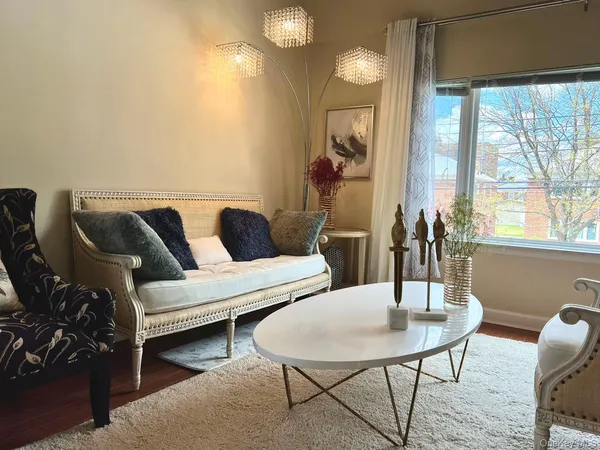 a living room with furniture and a table