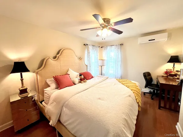 a bed room with a bed and a chandelier