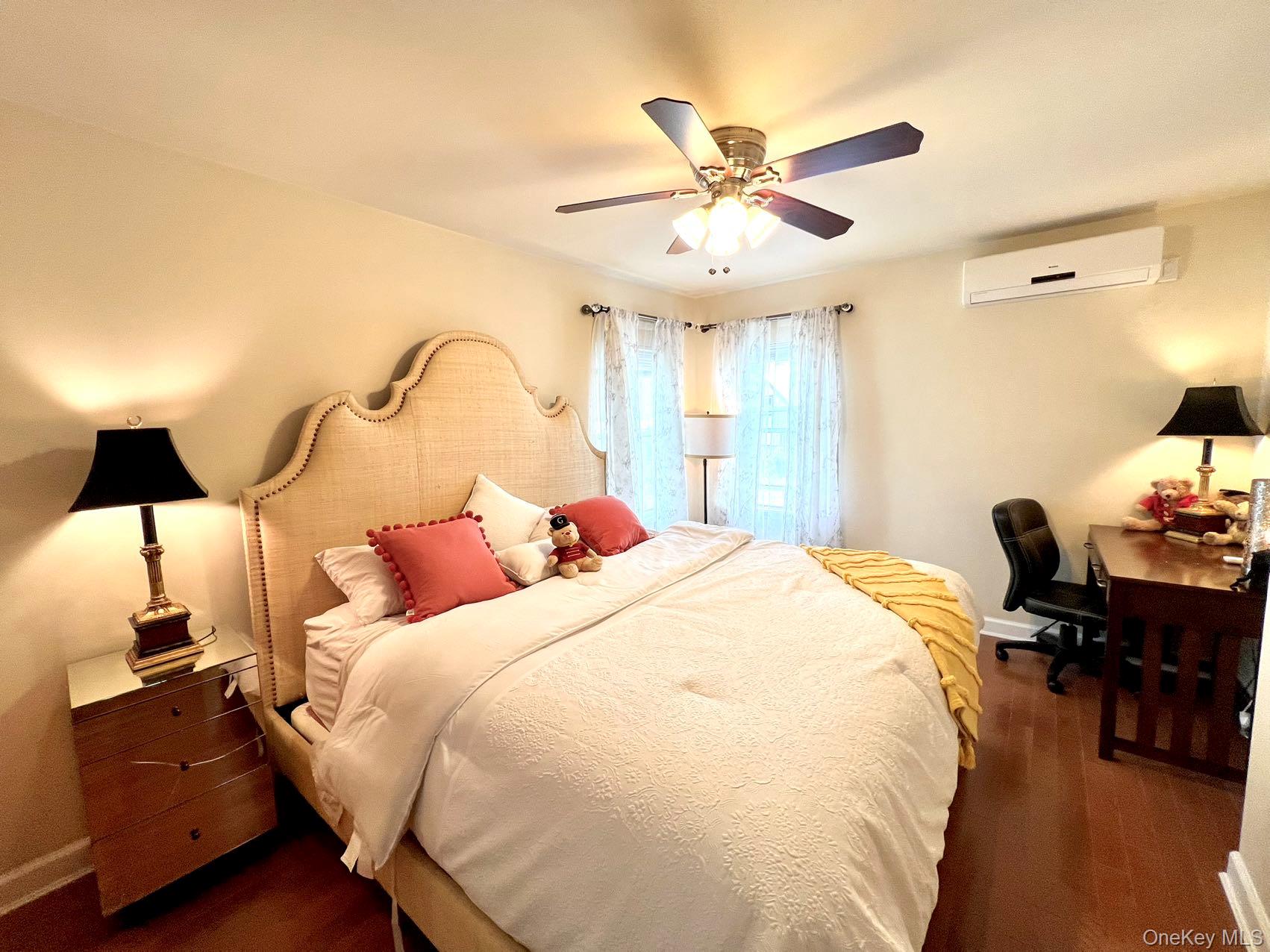 147-22 Ash Avenue Queens, NY 11355 - Photo 6 of 22 a bed room with a bed and a chandelier