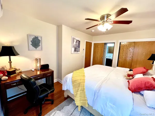 a bedroom with a bed and a lamp