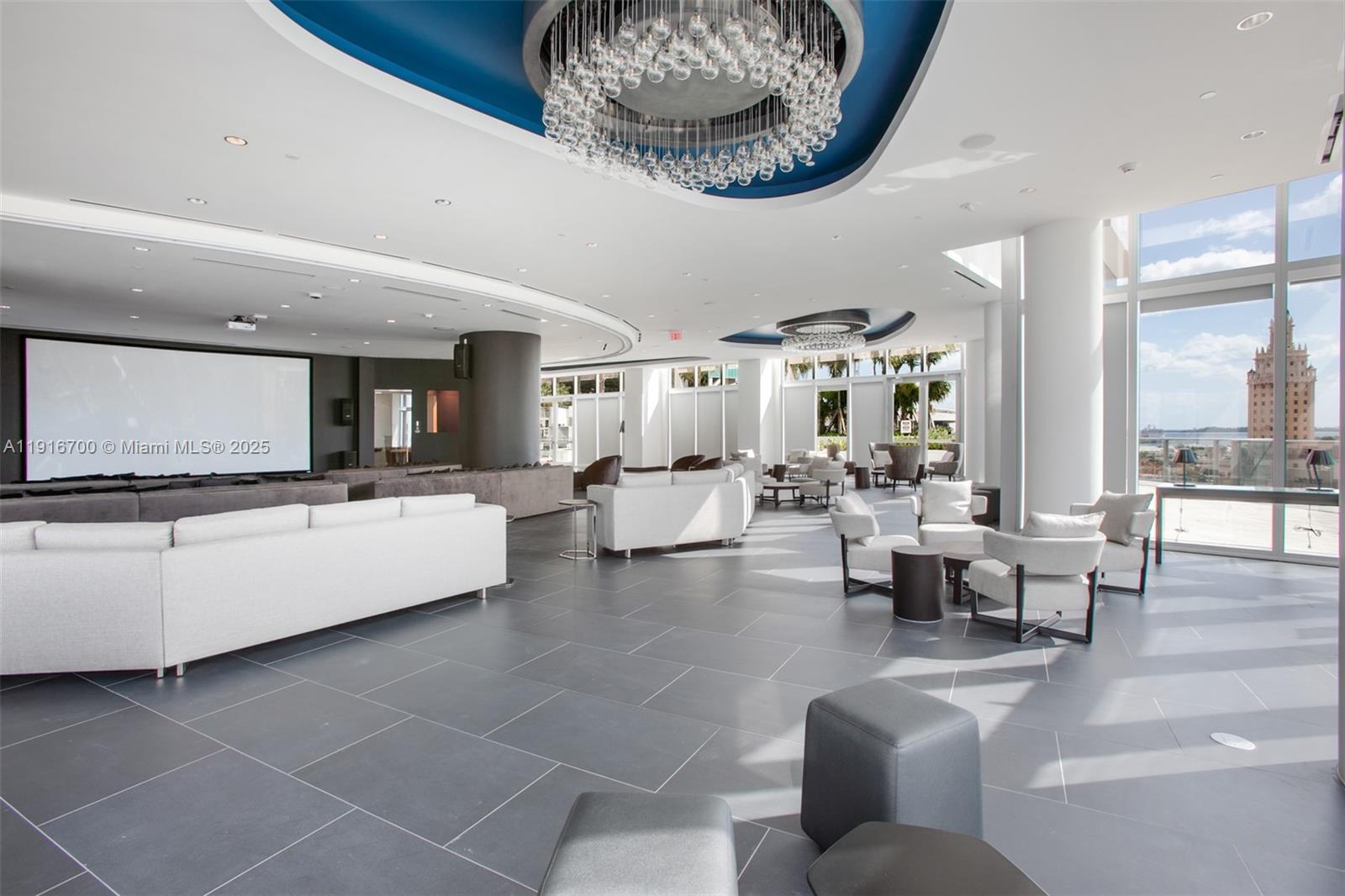 851 Northeast 1st Avenue, Unit 1810 Miami, FL 33132 - Photo 15 of 26 a living room with furniture and a flat screen tv