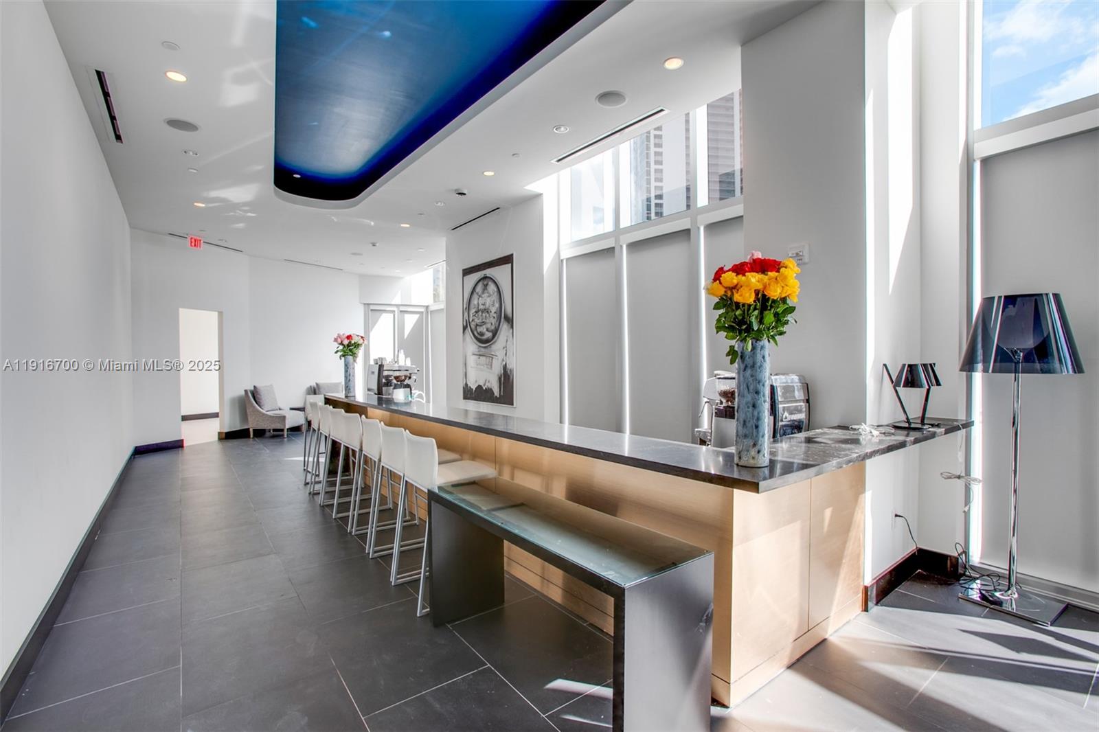 851 Northeast 1st Avenue, Unit 1810 Miami, FL 33132 - Photo 16 of 26 a dining hall with stainless steel appliances granite countertop a sink and a refrigerator