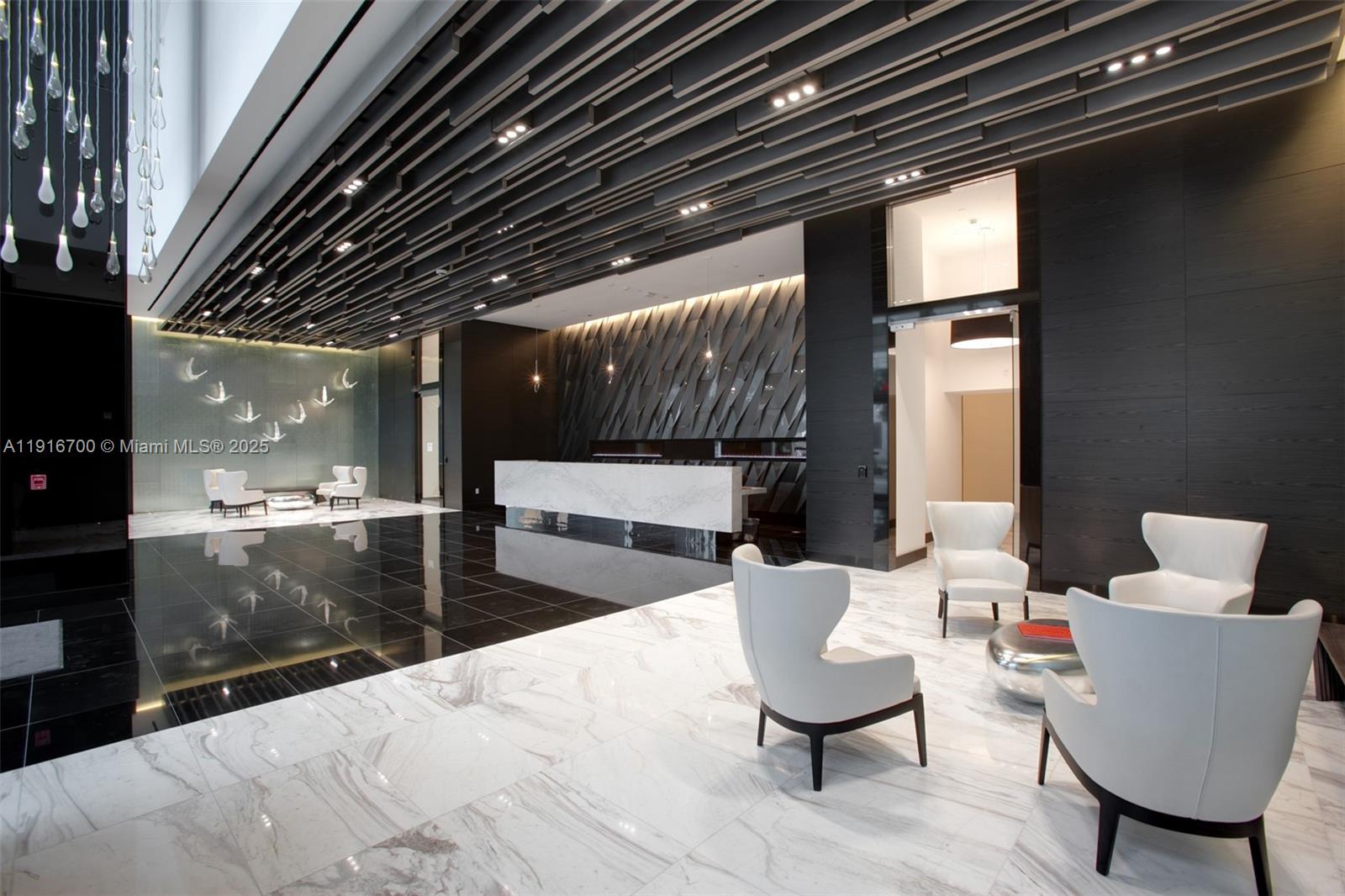 851 Northeast 1st Avenue, Unit 1810 Miami, FL 33132 - Photo 25 of 26 a living room with furniture and a fireplace