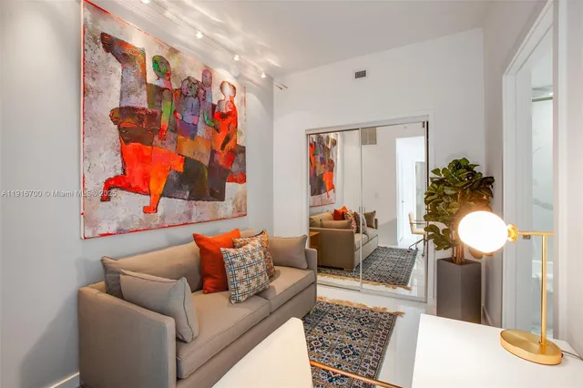 a living room with furniture and a rug