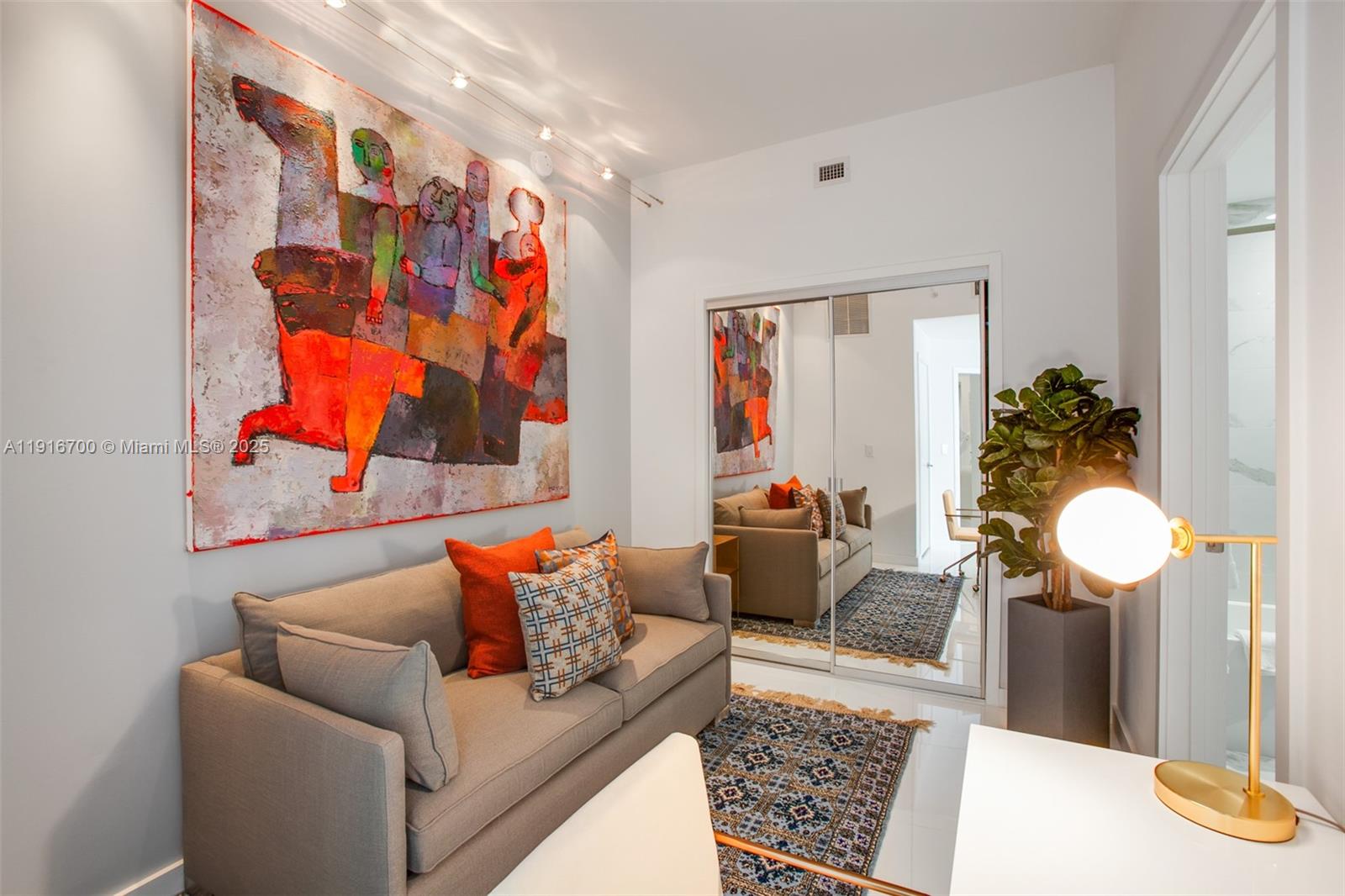 851 Northeast 1st Avenue, Unit 1810 Miami, FL 33132 - Photo 7 of 26 a living room with furniture and a rug