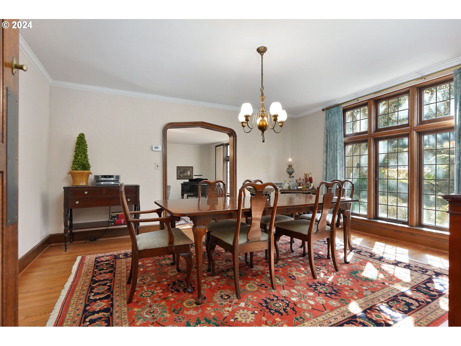 460 Leffelle Street South Salem, OR 97302 - Photo 7 of 48 a view of a dining room with furniture a chandelier and wooden floor
