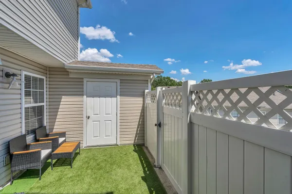 a backyard of a house with seating space