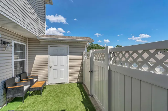 a backyard of a house with seating space