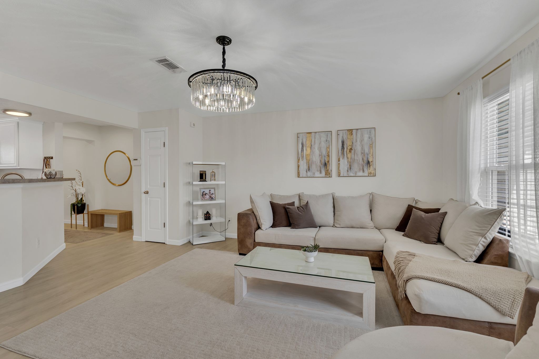 1792 Red Jacket Drive Antioch, TN 37013 - Photo 6 of 22 a living room with furniture a chandelier and a large window