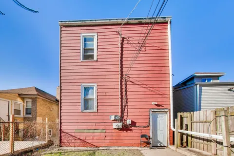 a view of a house with a street