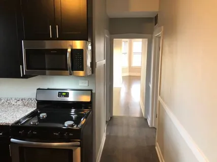 a kitchen with a stove and a microwave