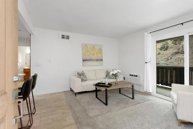 a living room with furniture and a window