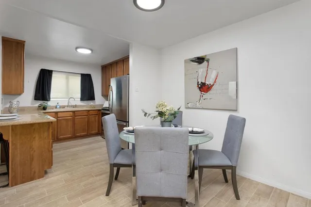 a dining room with furniture and window
