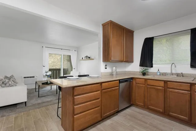 a kitchen with a sink and cabinets