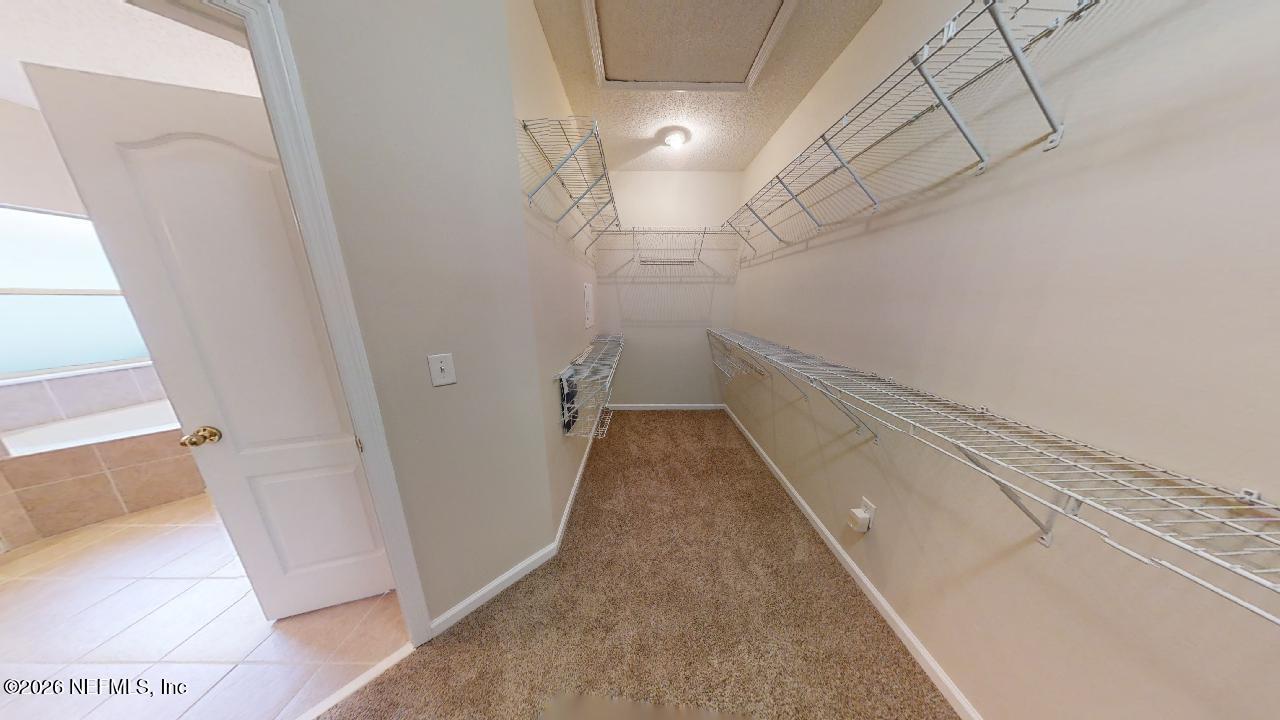 14454 Millhopper Road Jacksonville, FL 32258 - Photo 32 of 44 a view of a hallway with a white walls