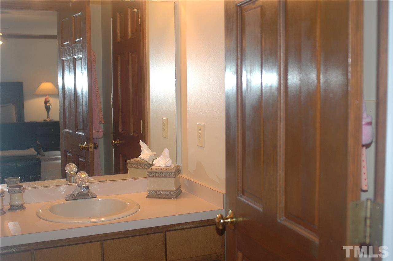 3008 Daventry Lane Raleigh, NC 27613 - Photo 20 of 25 Master Bath with walk in closet behind entry door.