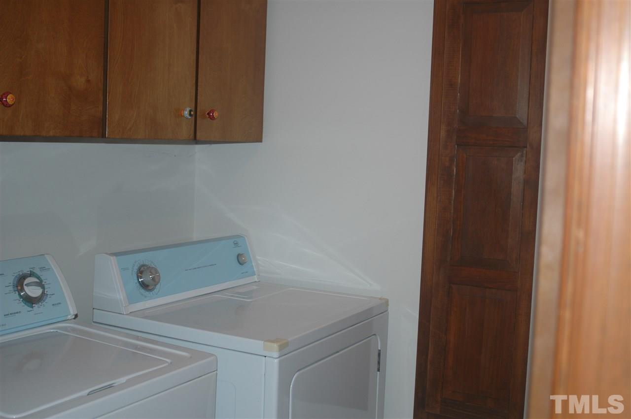 3008 Daventry Lane Raleigh, NC 27613 - Photo 25 of 25 Laundry Room. Washer and Dryer convey. Built in Ironing Board and large 2 door linen closet behind entry door.