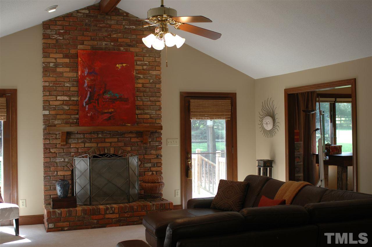 3008 Daventry Lane Raleigh, NC 27613 - Photo 8 of 25 Warm cozy Brick Fireplace for those cool autumn nights.