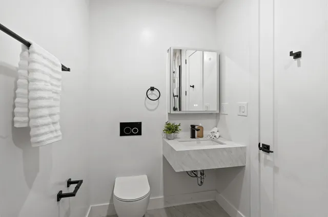 a bedroom with a large bed and a large window