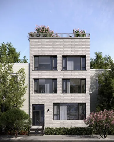 a view of a roof deck with couches and wooden floor