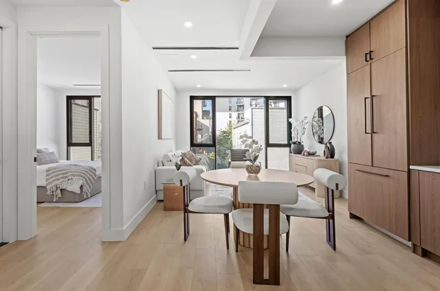 a kitchen that has a table and chairs in it